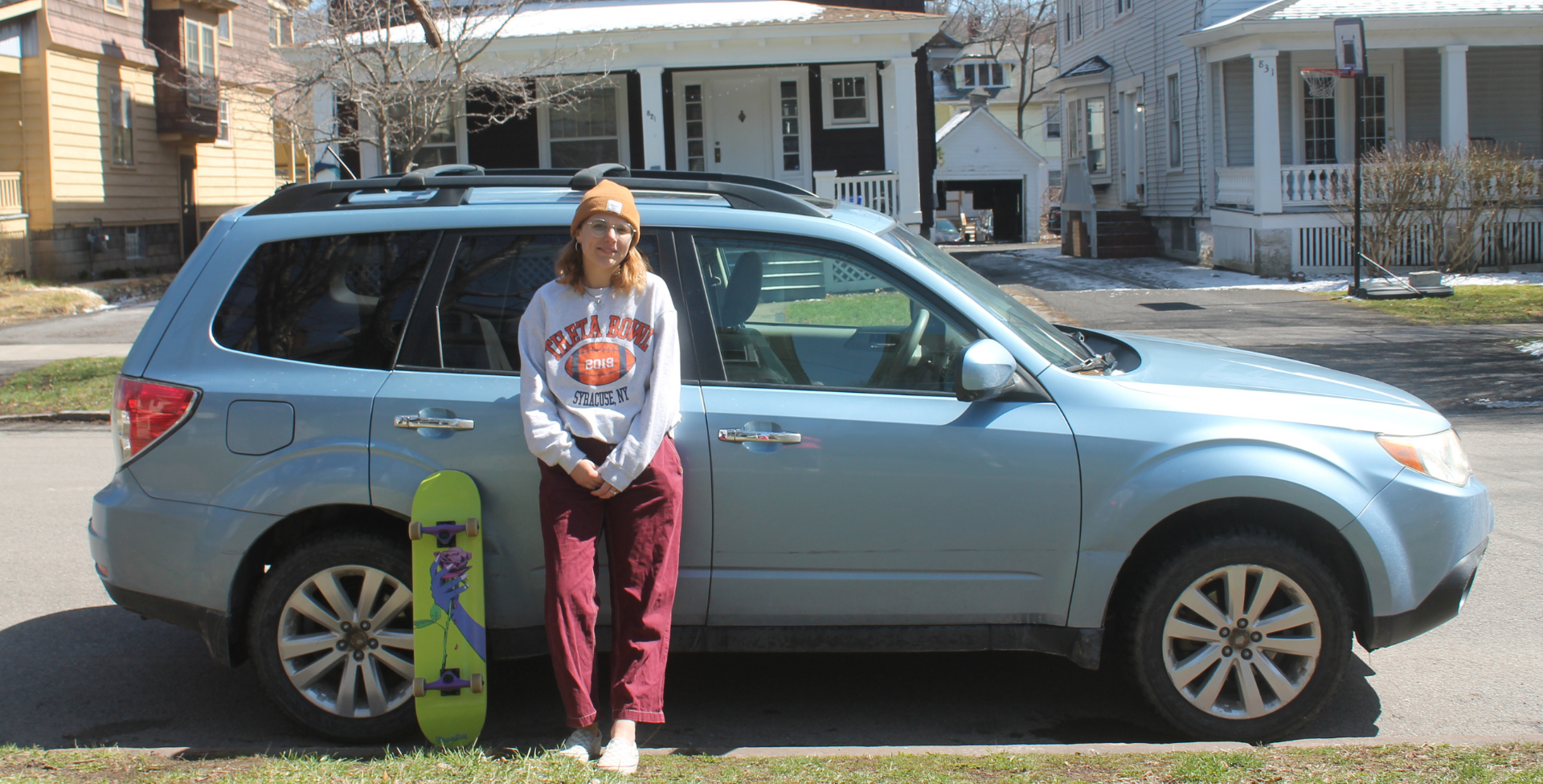 Hattie Lindert in front of car