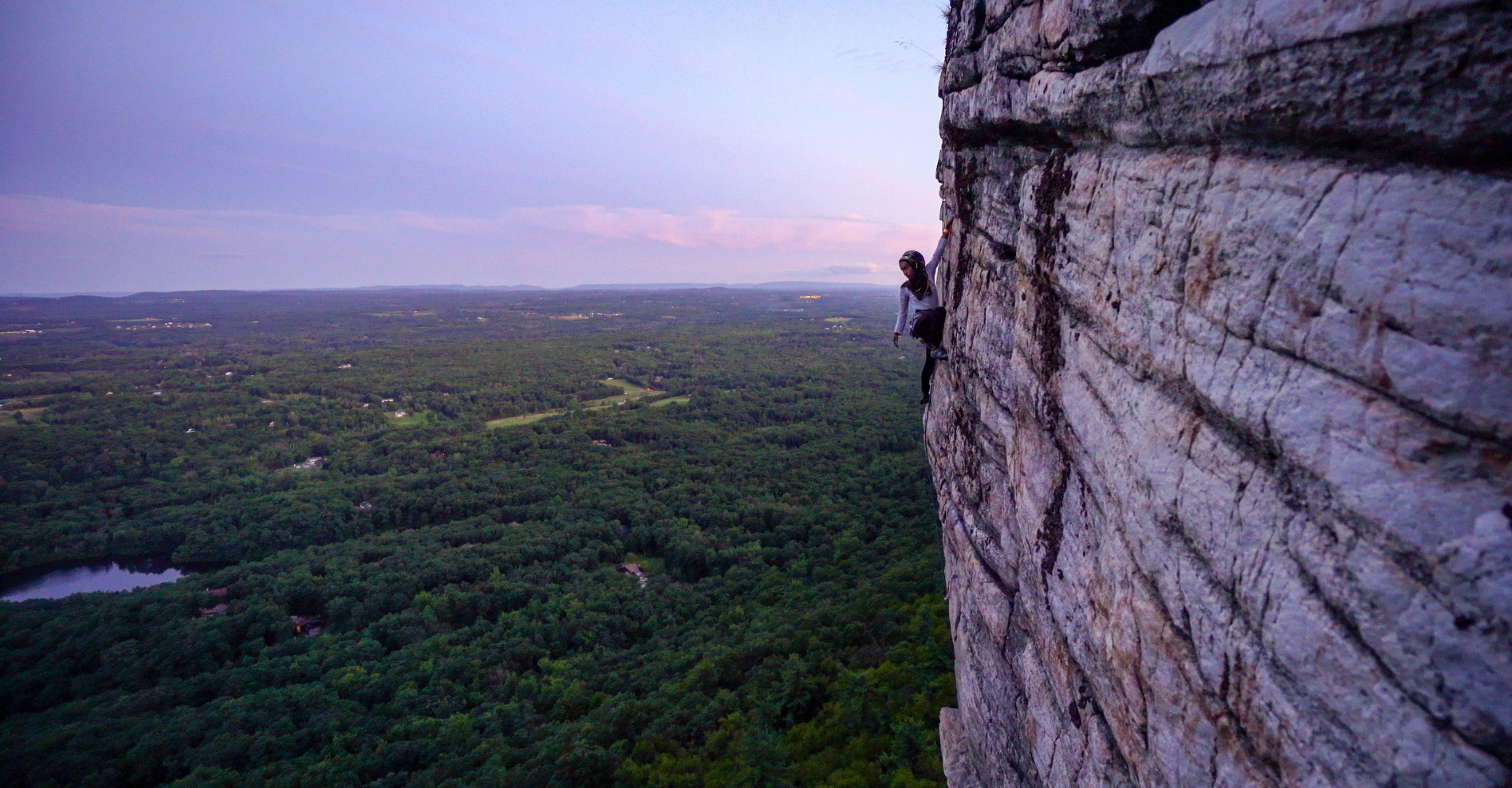 Woman climbing a mountain